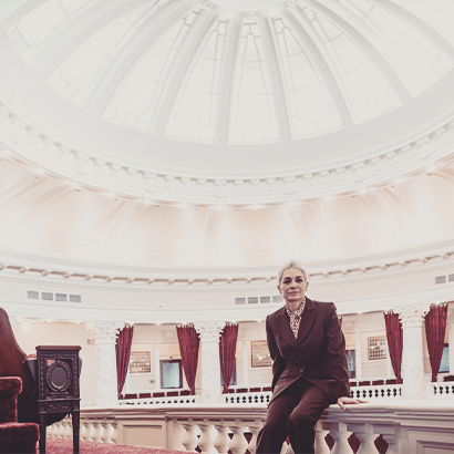Solo woman in government chamber building