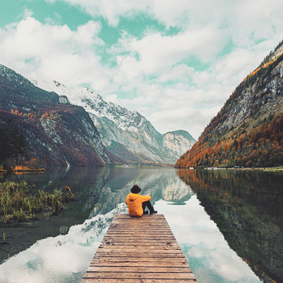 man sitting on a dock